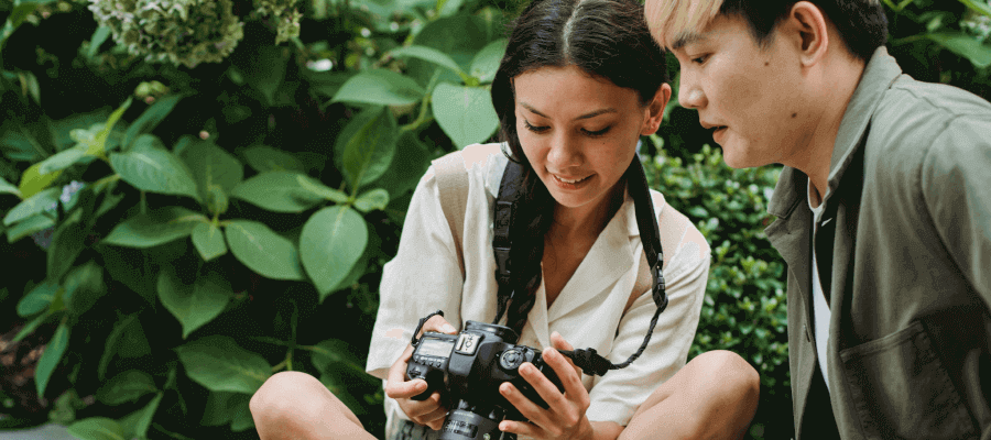 A photographer speaking to her client on a shoot