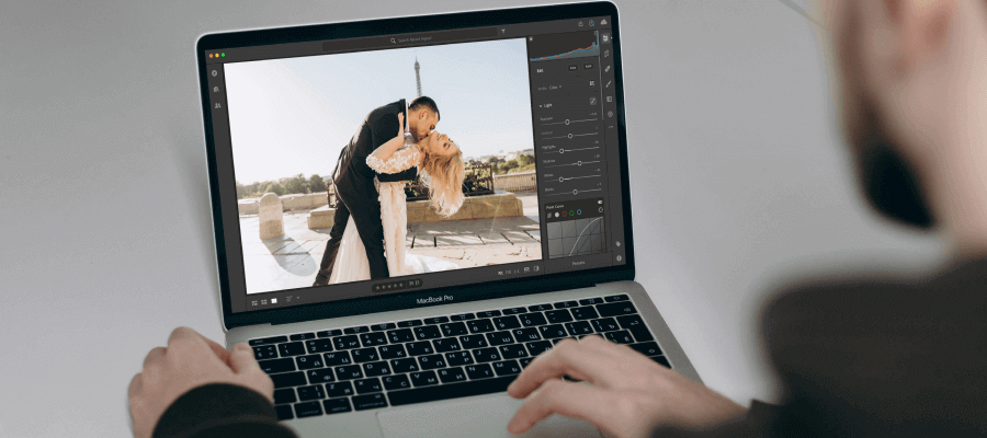 A photographer editing wedding photos