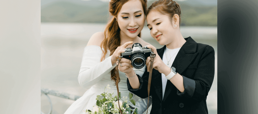 A photographer showing images to a client on her camera