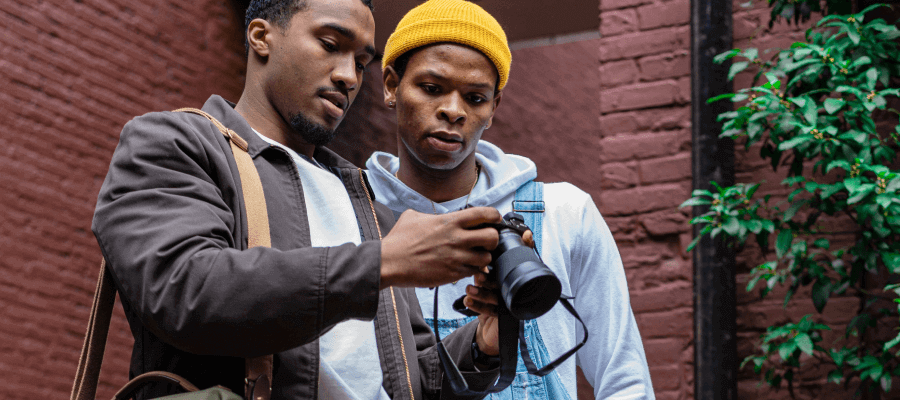 Photographer showing images he took on his camera