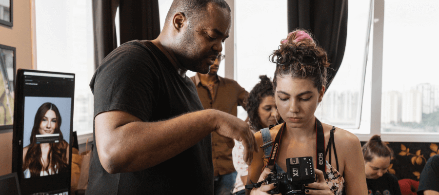 Photographer talking to woman at tradeshow