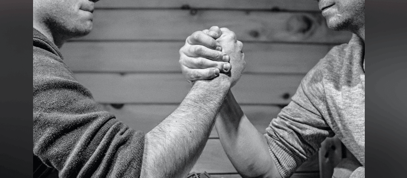 Two men arm wrestling