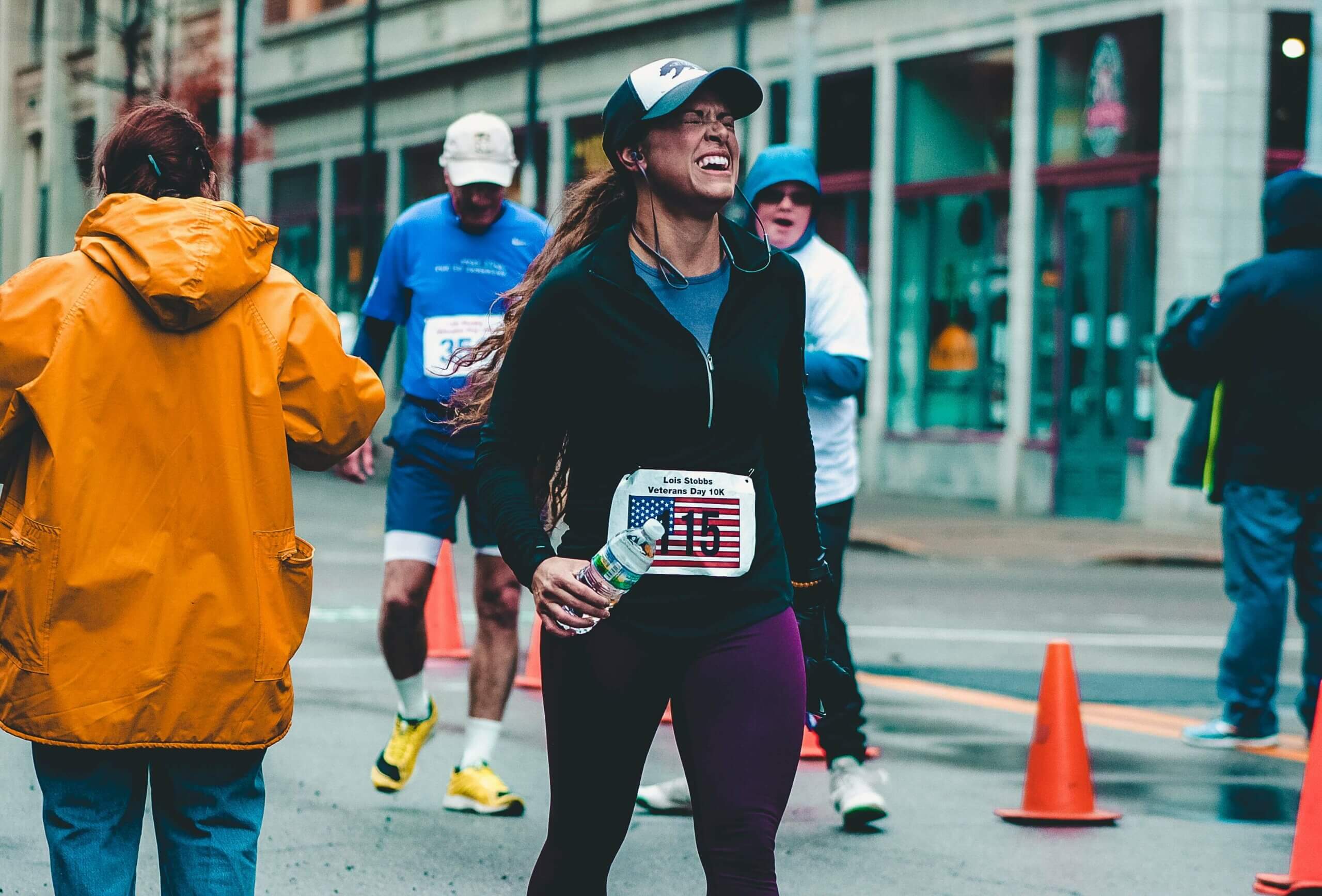 Runner at finish line after setting realistic goals