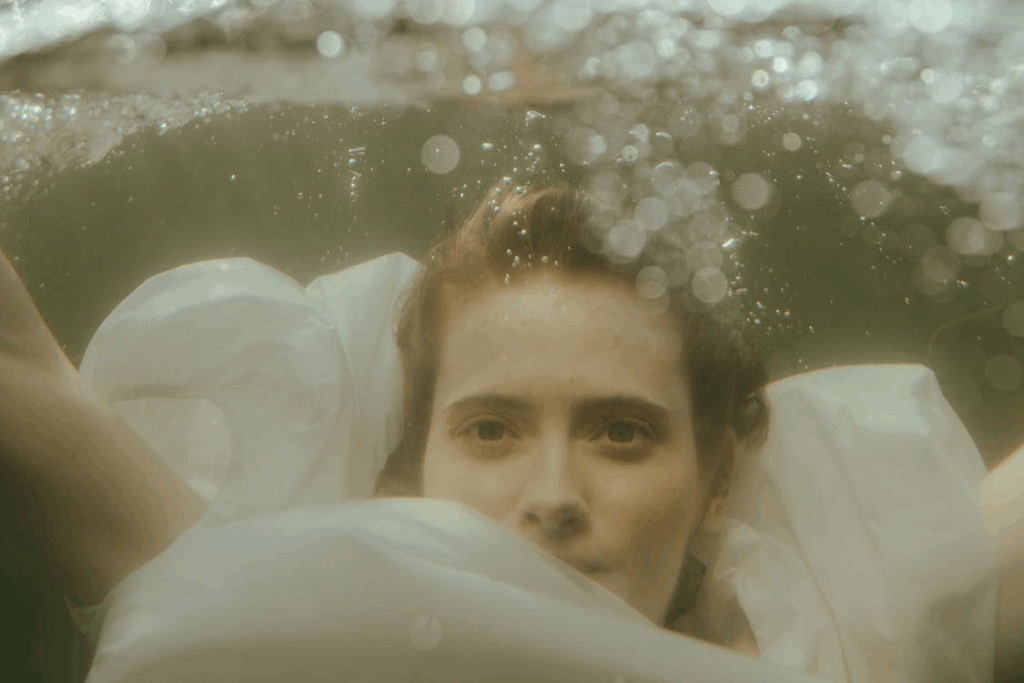 Dreamy pastel style underwater portrait photography