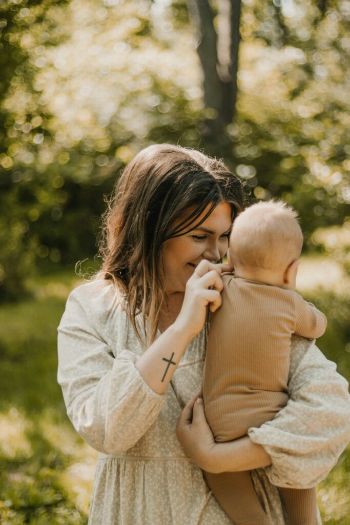 Light and airy portrait of woman holding a baby