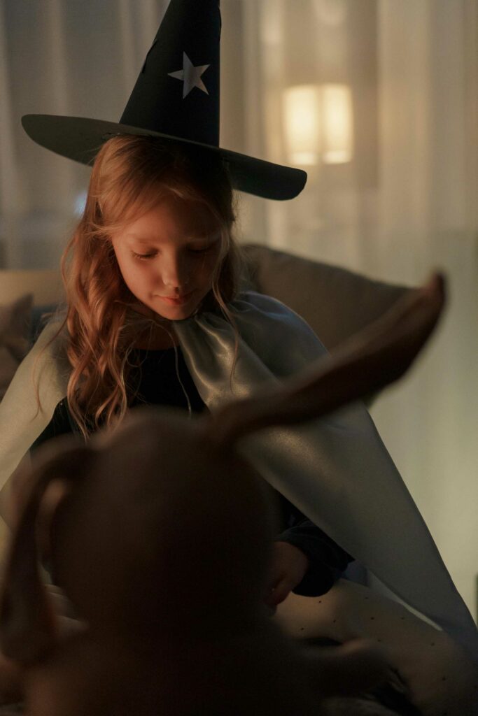 halloween photoshoot of girl wearing a witch hat