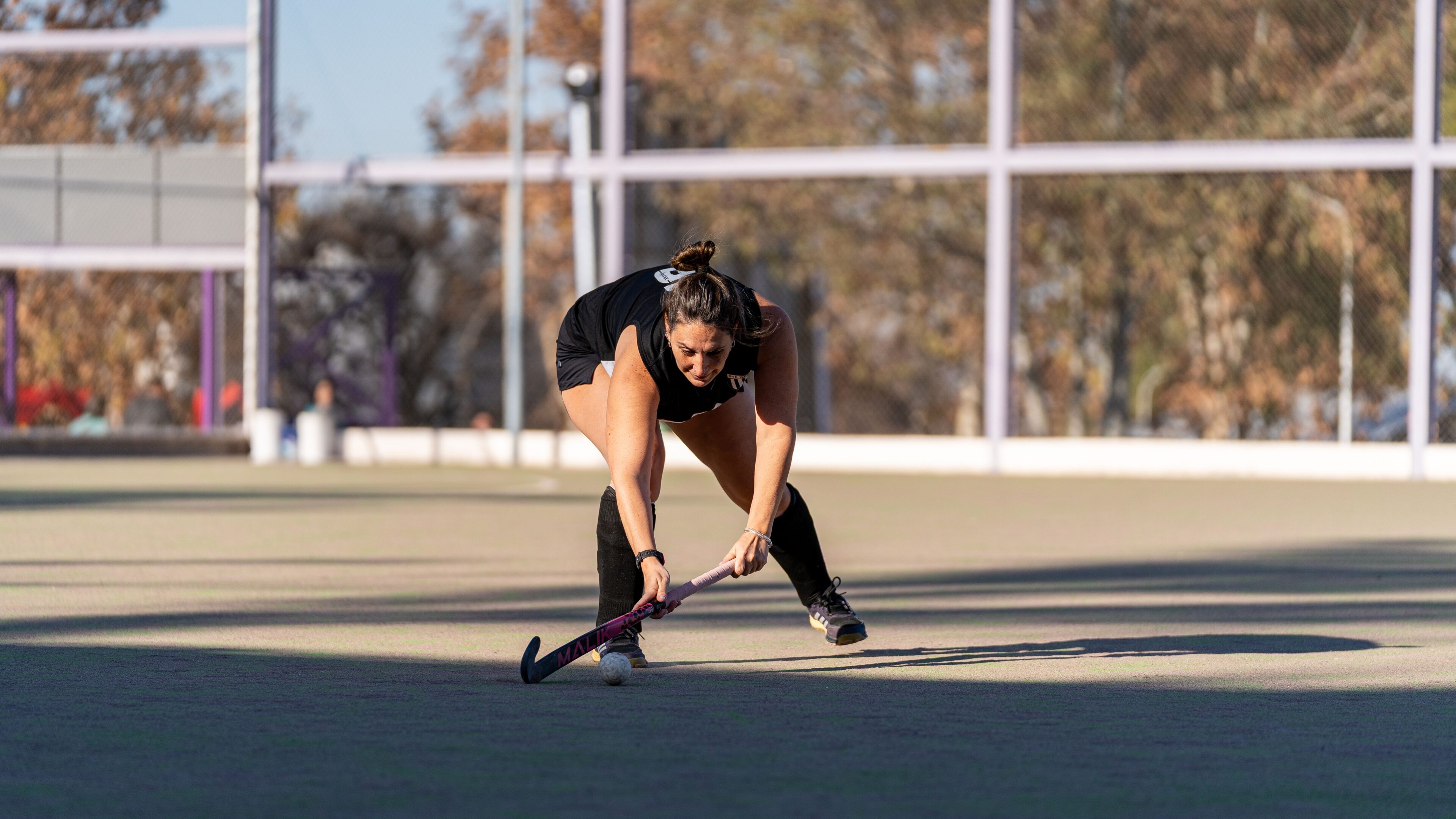 Sports Photography - Woman playing hockey
