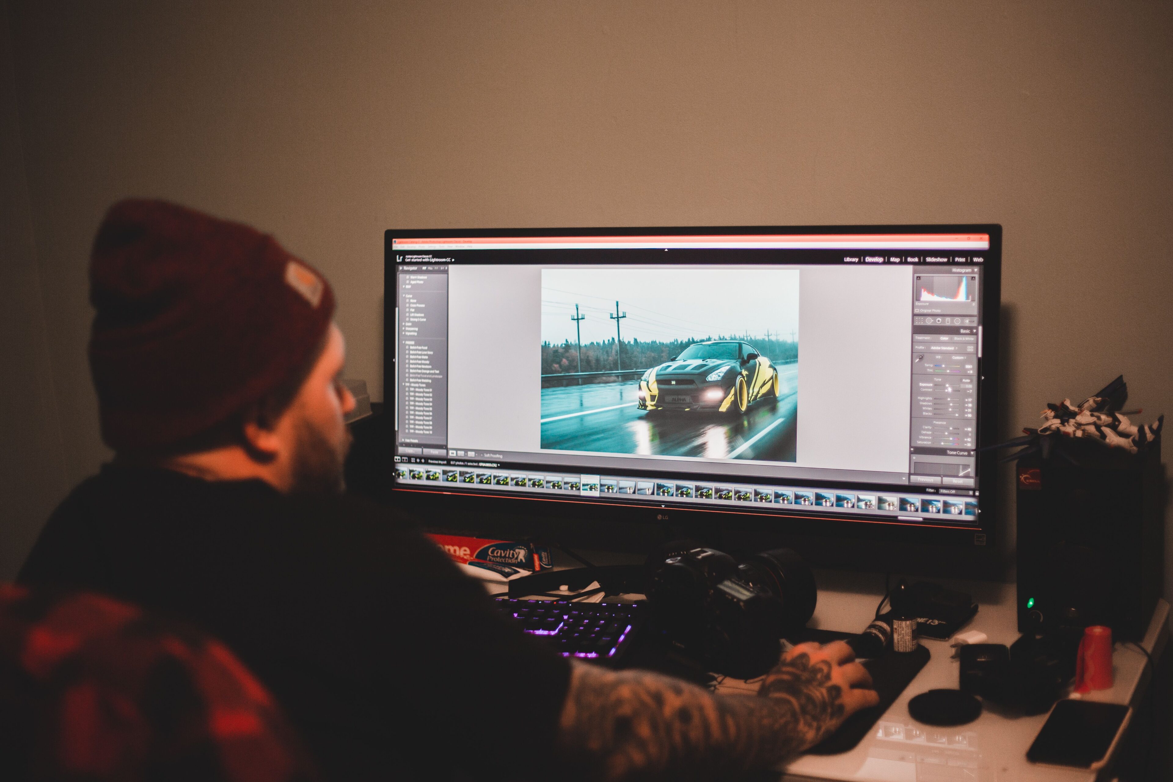 Photographer editing photos on a monitor
